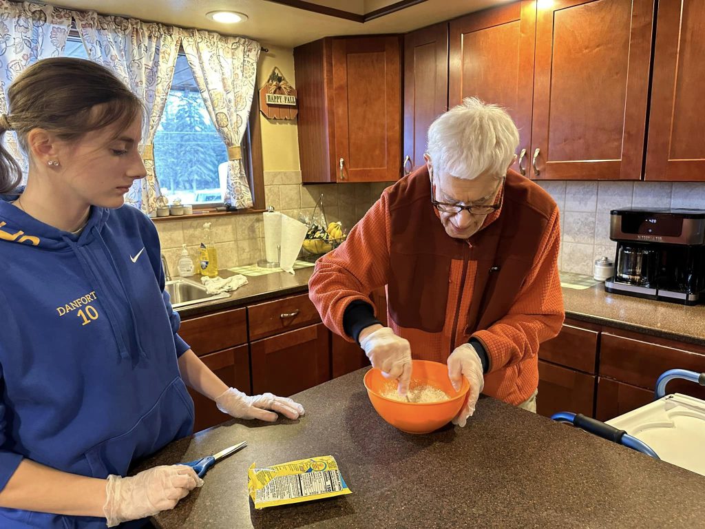 PTECH student and Lexington intern Jamie Danforth is pictured providing support in the kitchen at Lexington.