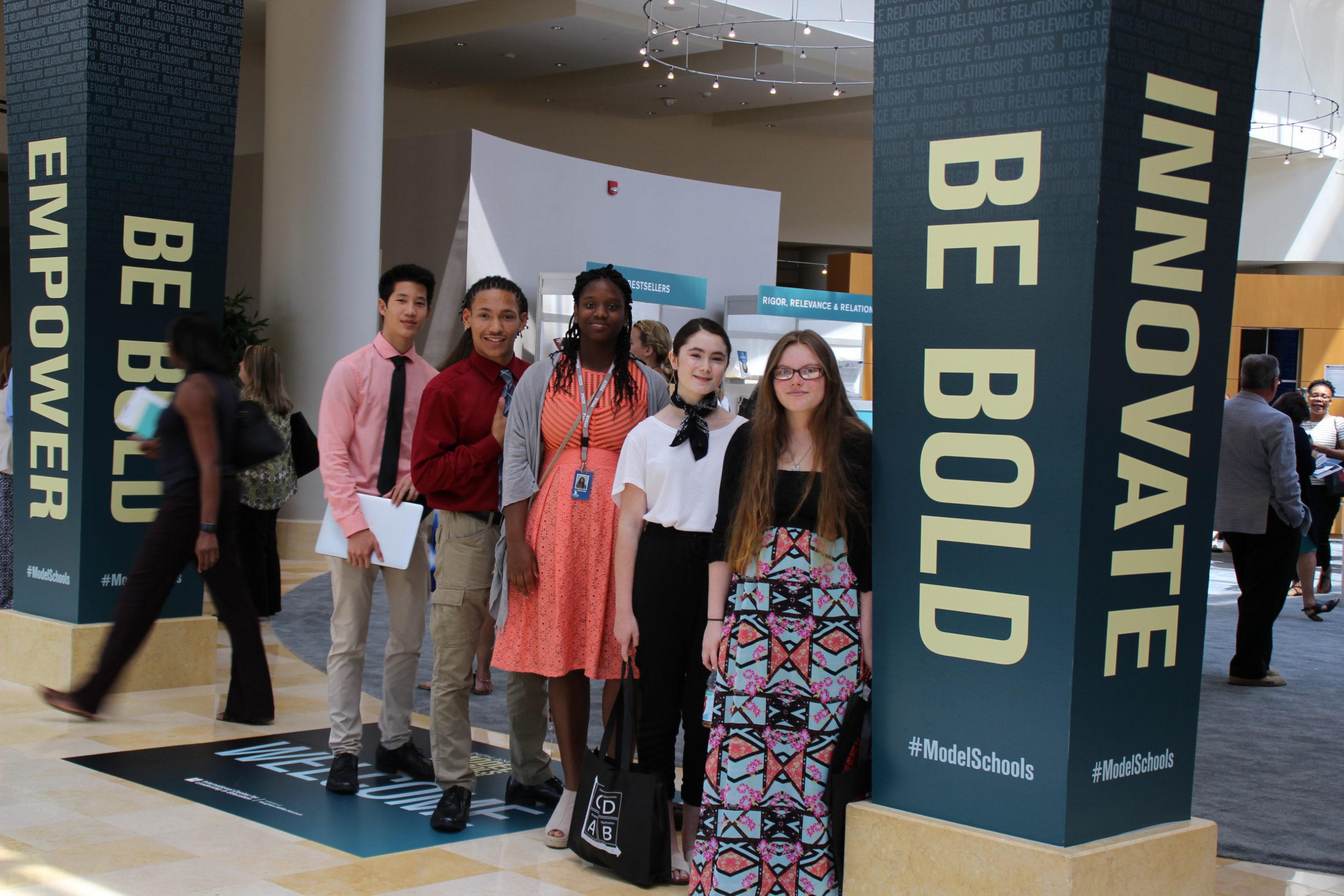 Group photo of five PTECH students at the 2016 Model Schools Conference in Orlando, Florida.